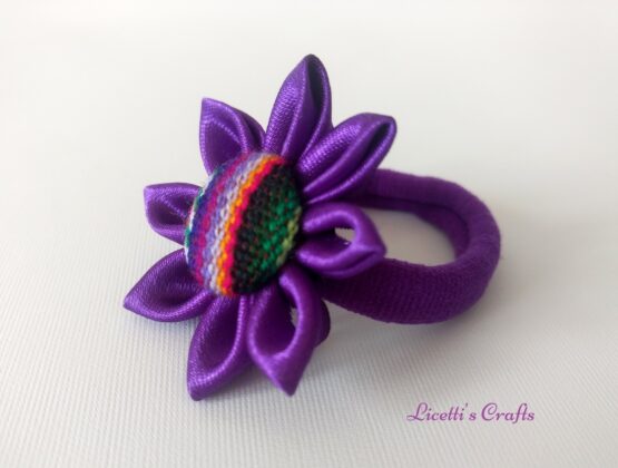 Coletero morado botón étnico.