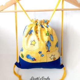 mochila infantil cuerdas algodón aviones amarilla