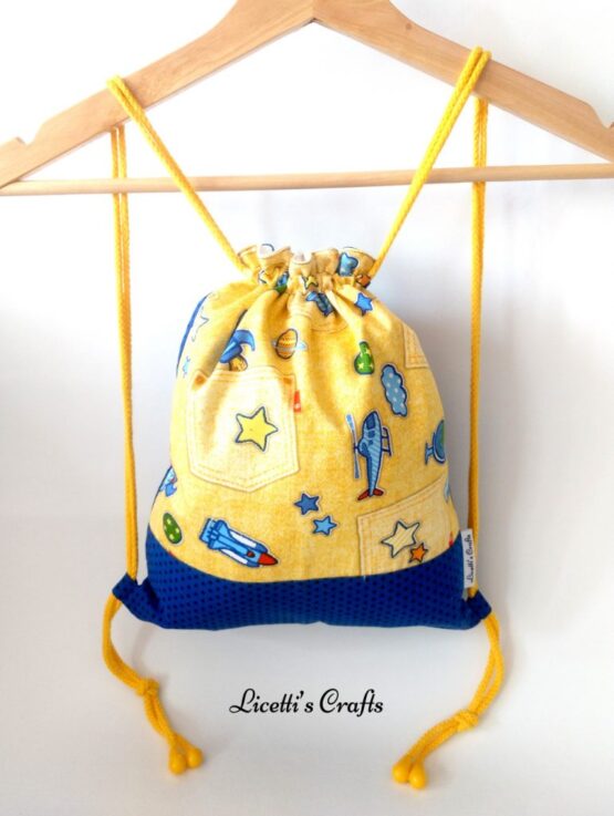 mochila infantil cuerdas algodón aviones amarilla