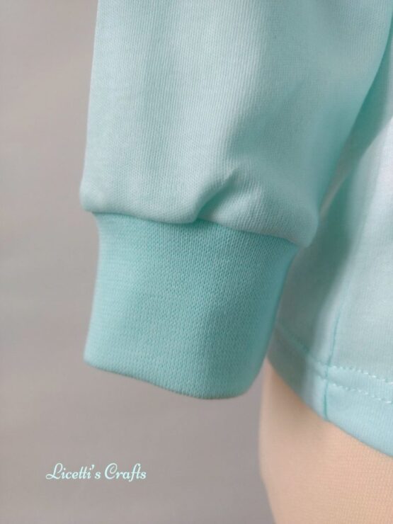 detalle puño camiseta bebé algodón pima verde