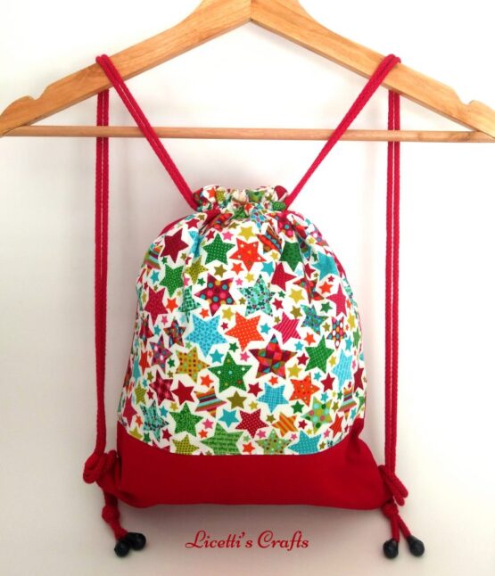 Mochila infanti cuerdas hecha a mano estrellas navideñas
