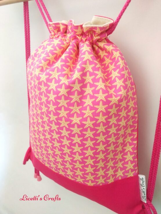 detalle mochila cuerdas forro algodón estrella de mar rosa