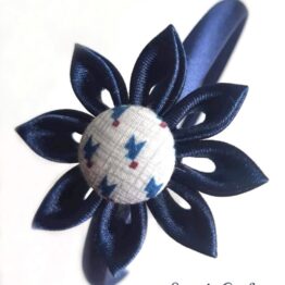 Diadema infantil "Pétalos azules botón estampado cubista"