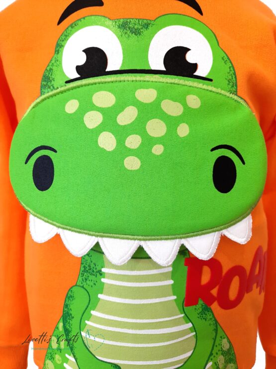 sudadera dinosaurio boca relieve naranja