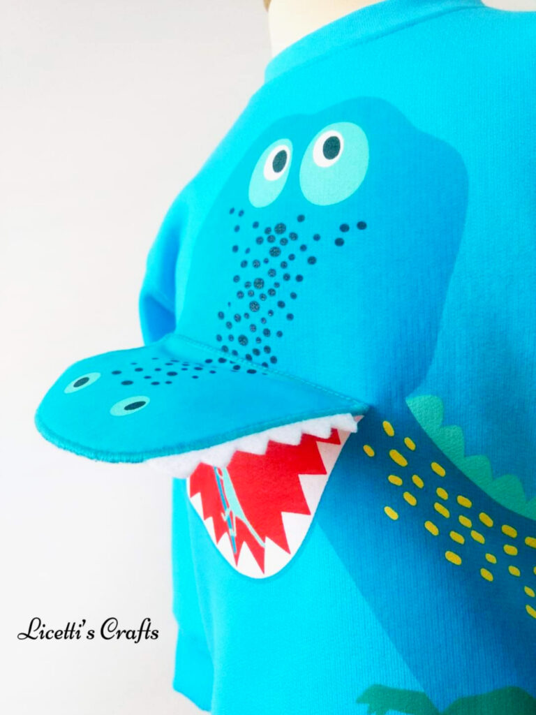 Sudadera dinosaurio turquesa