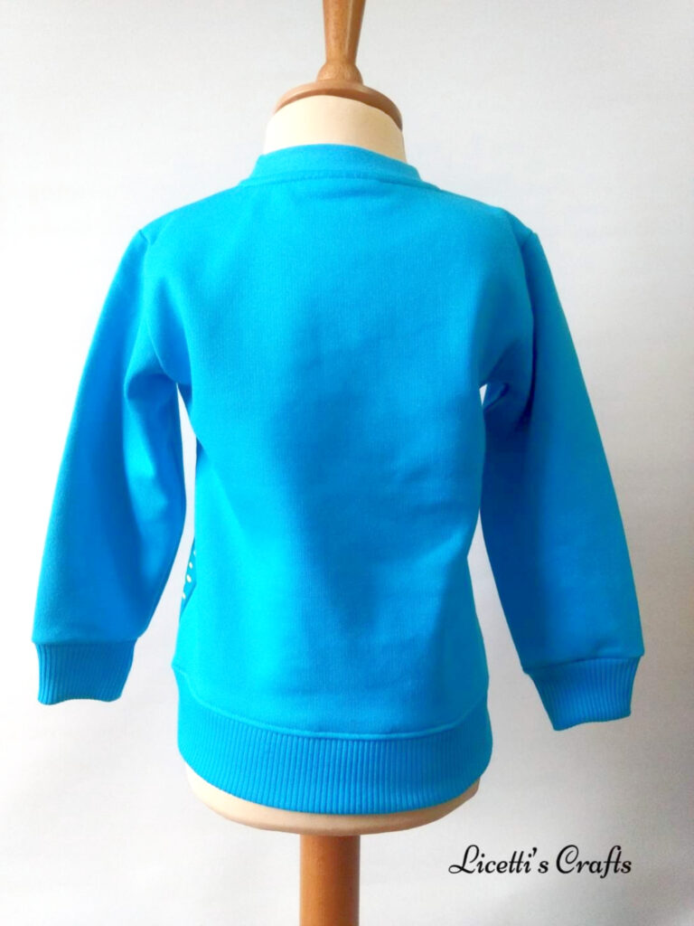 Espalda sudadera turquesa