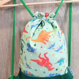 mochila cuerdas tela dinosaurios verde