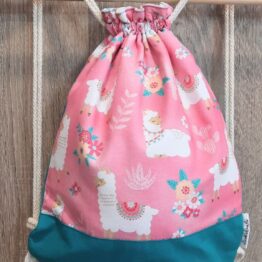 mochila cuerdas tela llamas turquesa