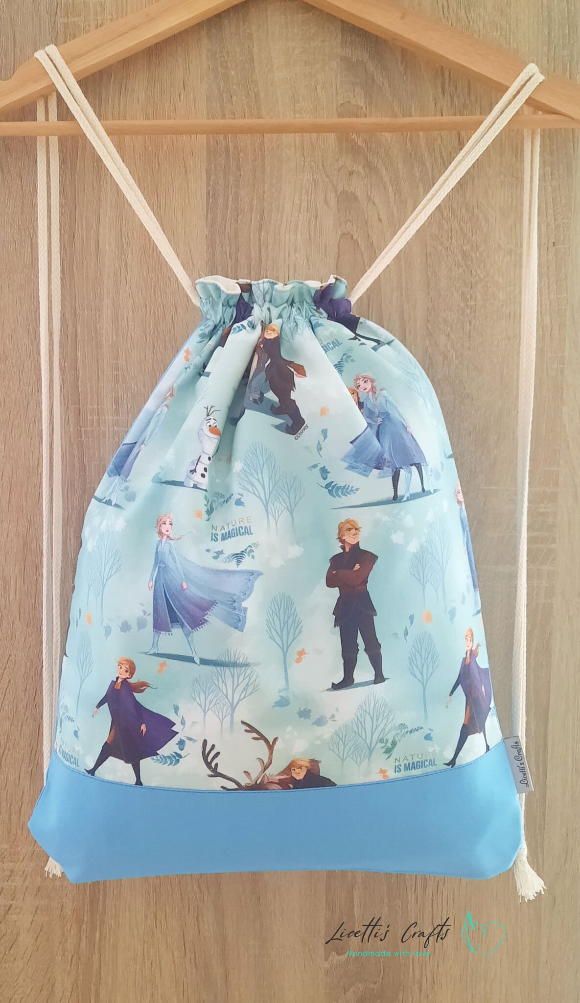 mochila de tela frozen de algodon 100 con cordones ajustables